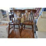 A pair of beech slat back dining chairs