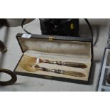 A cased set of salad servers