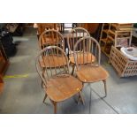 A set of four Ercol stick back dining chairs