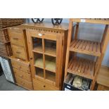 A pine cabinet fitted two drawers below