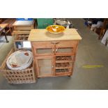 A beech kitchen trolley with integral wine rack