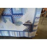 An approx. 8ft 8ins square patchwork quilt