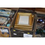 A box of various picture frames