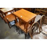 A pine nest of three occasional tables and a set o