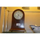 An Edwardian mahogany and inlaid mantel clock (the