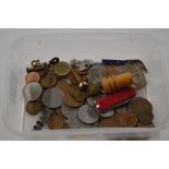 A plastic tray or various coins, a pen knife etc.