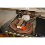 A brown leather cartridge belt; a cartridge bag; a