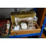 A New Home sewing machine, in fitted case, sold as