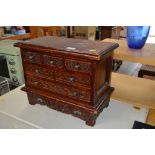 A hardwood Multi drawer table top chest