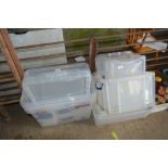 A quantity of plastic storage boxes