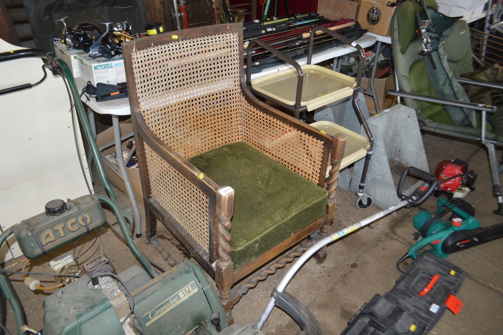 A beech and cane armchair