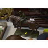 A bronzed horse and jockey ornament