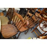 A set of three slat back dining chairs
