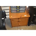 A pine chest fitted two drawers