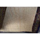 An approx. 9ft 8ins x 6ft 6ins Rattan rug