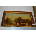 A gilt framed oil on canvas depicting a house by a