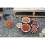 A quantity of terracotta planters; two blue glazed