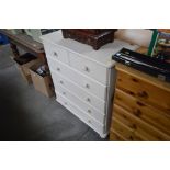 A white painted pine chest fitted two short over f
