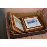 A box containing various prints and pictures