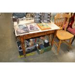 A marble topped table raised on pine base