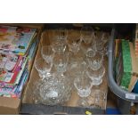 A box of various drinking glasses, glass jug, bowl