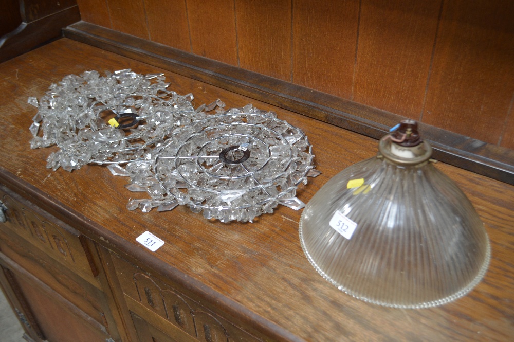 A glass light shade and two other light shades