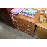 A teak chest, fitted four drawers