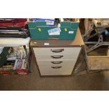 A metal four drawer filing chest