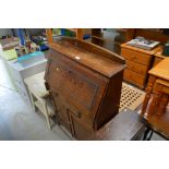 An oak bureau fitted single drawer