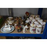 A quantity of rose decorated storage jars, various