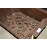 A tray box containing numerous old clamps