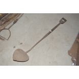 A long handled turfing spade