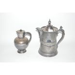 A 19th Century Britannia metal lidded jug, with fo