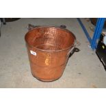 A copper pail with iron swing handle