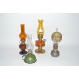 Four various oil lamps