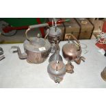 Various copper kettles and a copper funnel