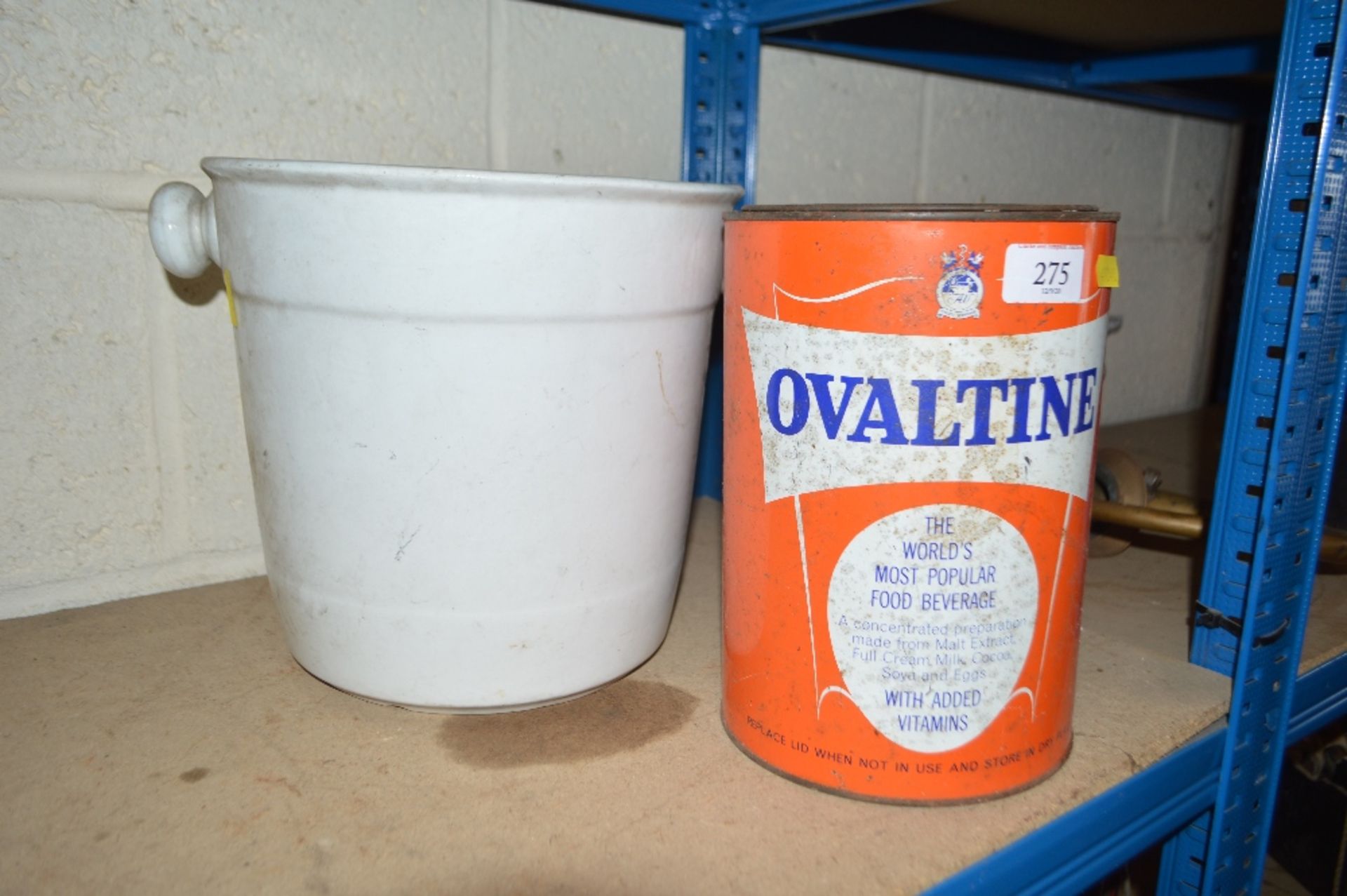 An old Ovaltine canister and a white china slops p