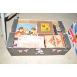 A box of various games including Monopoly, table t