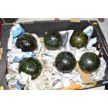 A collection of six green glass fisherman's floats