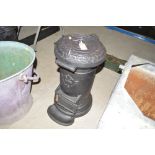 A cast iron upright stove