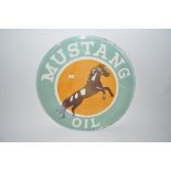 An enamel "Mustang Oil" circular advertising sign,