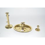 Three various brass candlesticks with slide ejecto