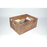 A Vintage wooden advertising crate and contents of