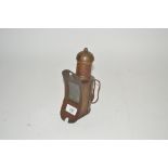 An unusual small brass hand lamp
