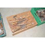 A box containing numerous wood chisels, (approx. 5