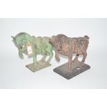 A bronze classical horse figure and a cast iron si