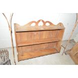 An Antique stripped pine hanging wall shelf