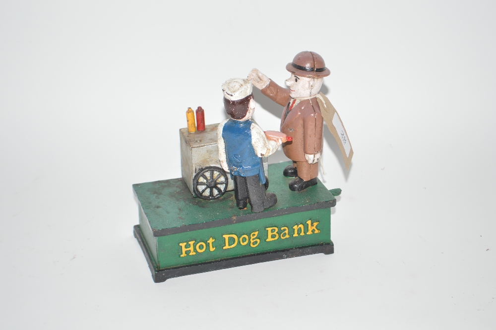 A novelty cast iron moneybox, "Hot Dog Ban