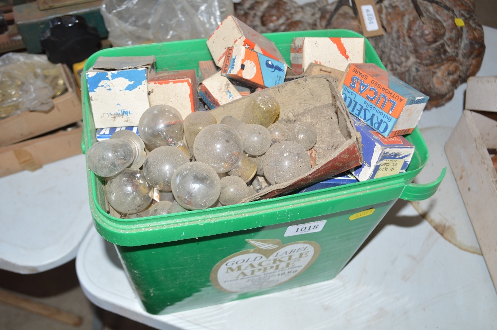 A collection of various old light bulbs, some in o