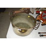 An Antique brass preserve pan with iron handles